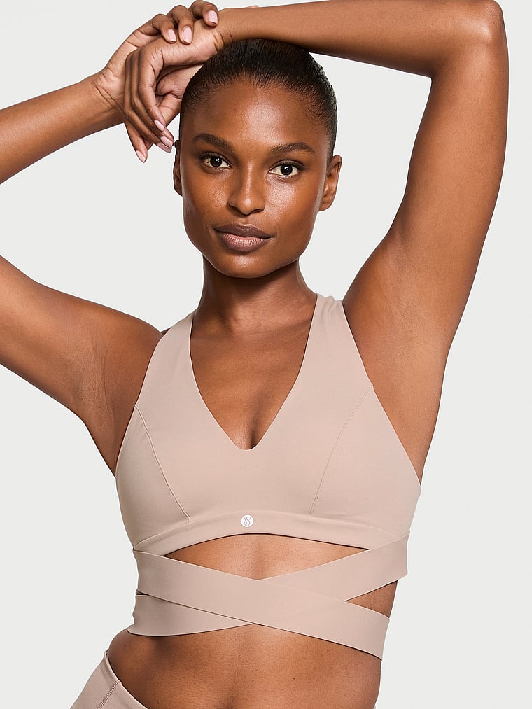 Victoria's Secret, VSX VSX Elevate™ Plunge Wrap Sports Bra, Bare Taupe, onModelFront, 1 of 3 Tsheca is 5'9" or 175cm and wears 34B or Small