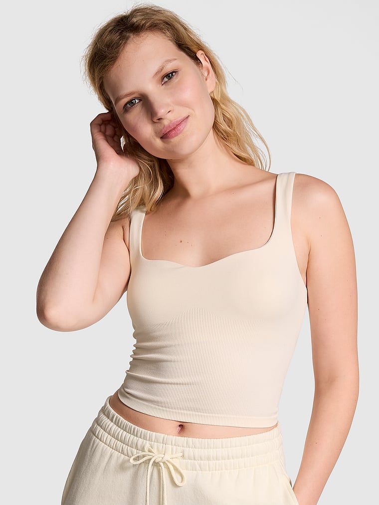 PINK Soft Seamless Notched Tank Top, White Shell, onModelFront, 1 of 3 Anabel is 5'8" or 173cm and wears 32B or Small
