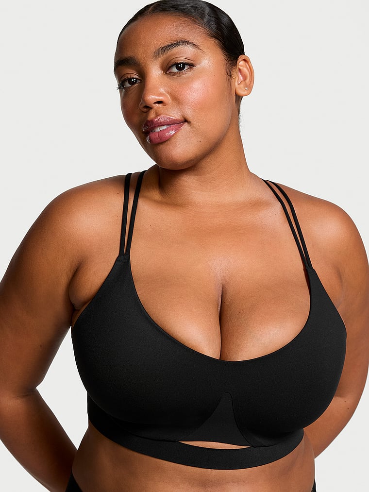 Victoria's Secret, VSX VSX Elevate™ Strappy-Comfort Sports Bra, Black, onModelFront, 1 of 2 Nikita is 5'10" or 178cm and wears 34B or Small