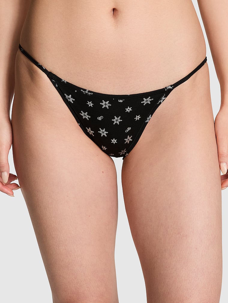 PINK Cotton String Bikini Panty, Pure Black Foil Snowflake Print, onModelFront, 1 of 3 Gloria is 5'9" or 175cm and wears Small