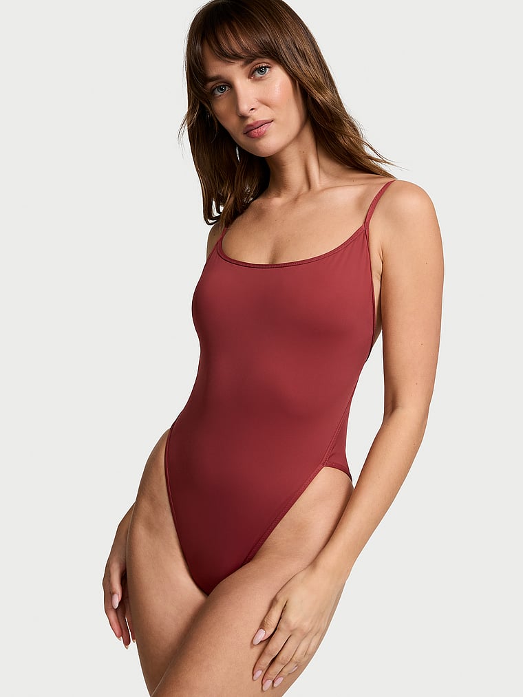 Victoria's Secret, Victoria's Secret Swim Essential High-Leg Cheeky One-Piece Swimsuit, Russet, onModelFront, 1 of 3 Ari is 5'9" or 175cm and wears Small