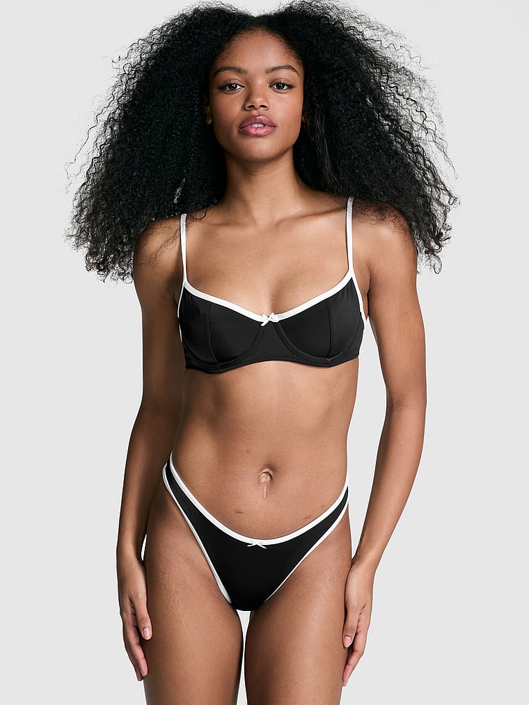 PINK by Frankies Bikinis Golden Hour Bikini Bottom, Black, onModelFront, 1 of 3 Jordan is 5'9" or 175cm and wears Small