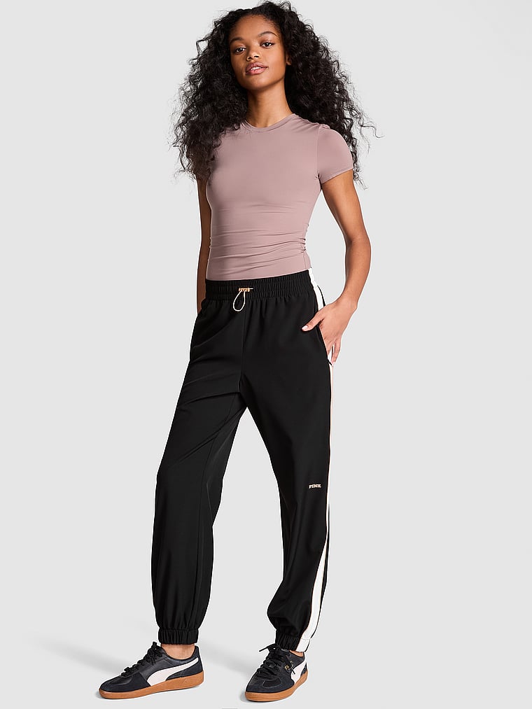 PINK Tech Woven Jogger Pants, Pure Black, onModelFront, 1 of 4 Jordan is 5'9" or 175cm and wears Small
