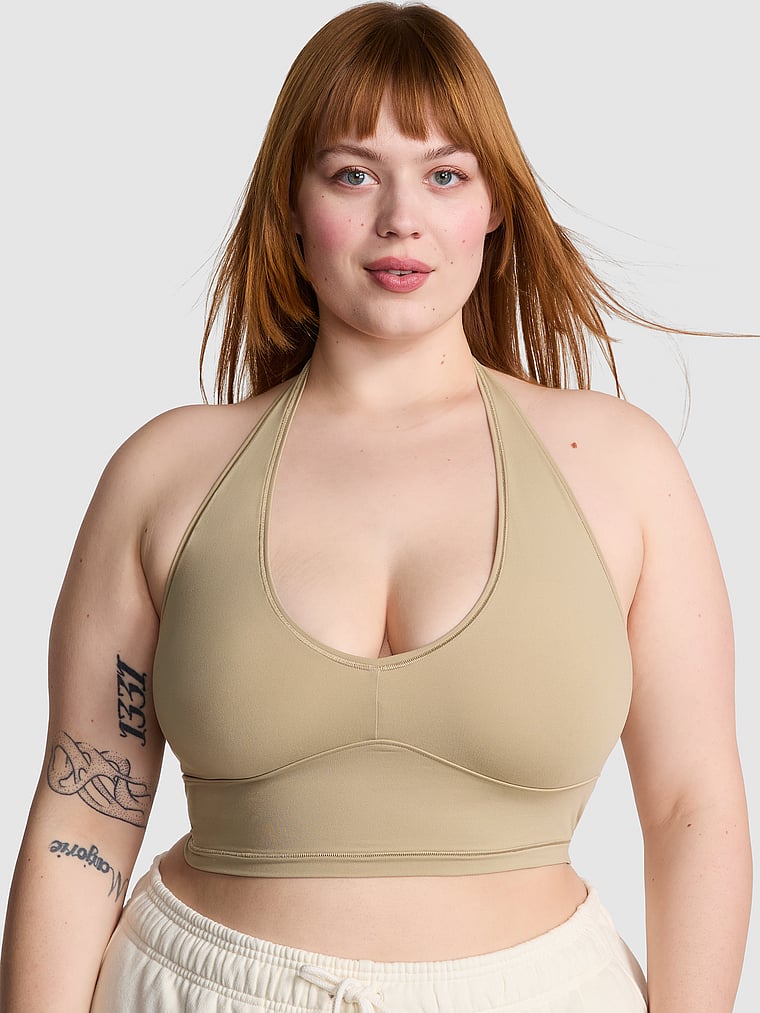PINK Bralettes & Bra Tops Base Stretch Halter Bra Top, Sahara, onModelFront, 1 of 3 Lulu is 5'7" or 170cm and wears 38DDD (F) or Large