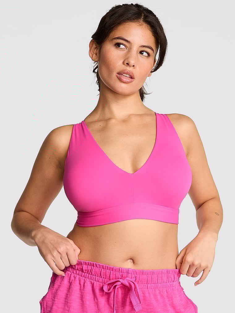 PINK Relay Strappy Plunge Sports Bra, Pink Gossip, onModelFront, 1 of 3 Isabella is 5'9" or 175cm and wears 36B or Medium